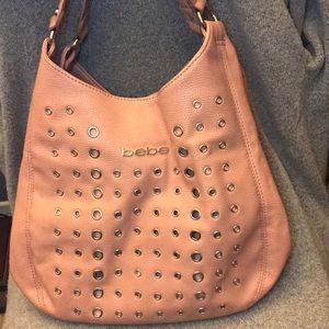 Coral/pink Hobo leather bag.